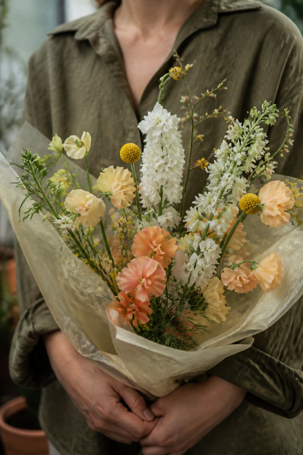 A bouquet wrapped in cream paper